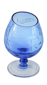 A shot glass of cognac (blue)